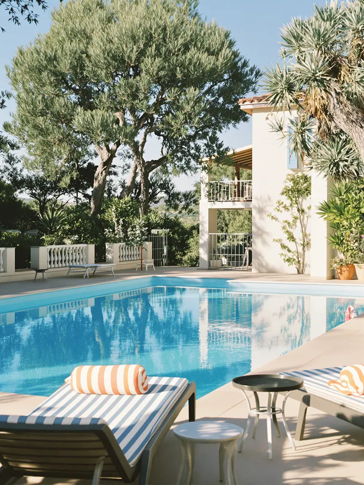 A holiday villa with a swimming pool and olive trees